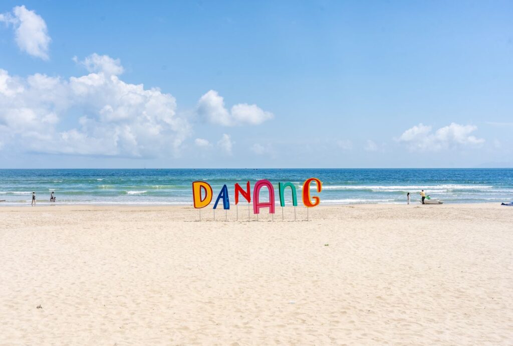 Bright and sunny day at Da Nang beach in Vietnam with clear skies and a calm sea.